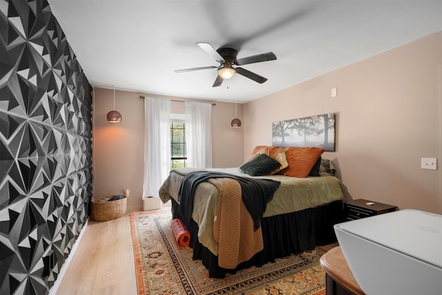 bedroom featuring ceiling fan and wood-type flooring