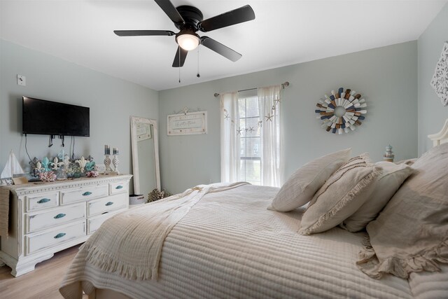 bedroom featuring ceiling fan and light hardwood / wood-style flooring