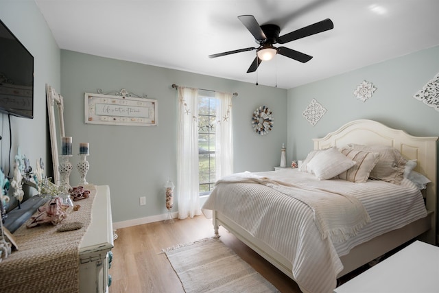 bedroom featuring ceiling fan and light hardwood / wood-style flooring