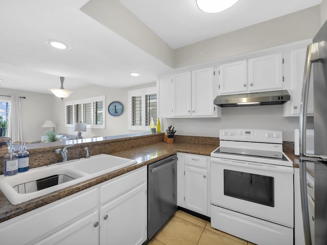 850 A1A Beach Blvd Unit 42, Saint Augustine Beach, FL 32080 - kitchen featuring appliances with stainless steel finishes, under cabinet range hood, a sink, white cabinets, and recessed lighting