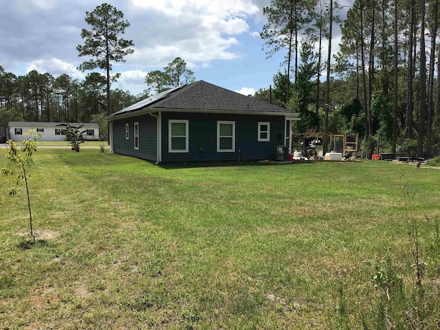 view of property exterior featuring a lawn