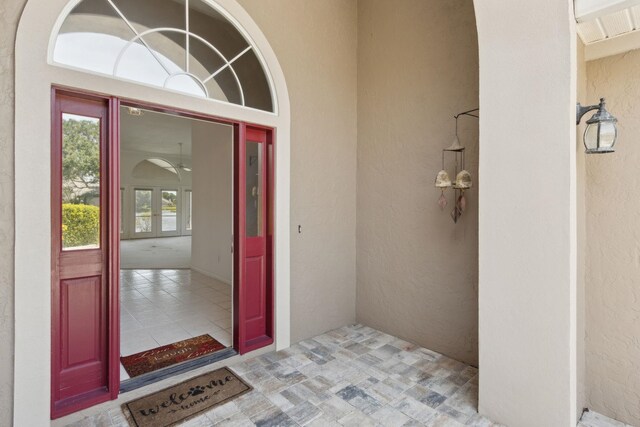 doorway to property with french doors and stucco siding