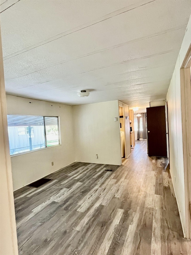 spare room featuring light wood-style floors