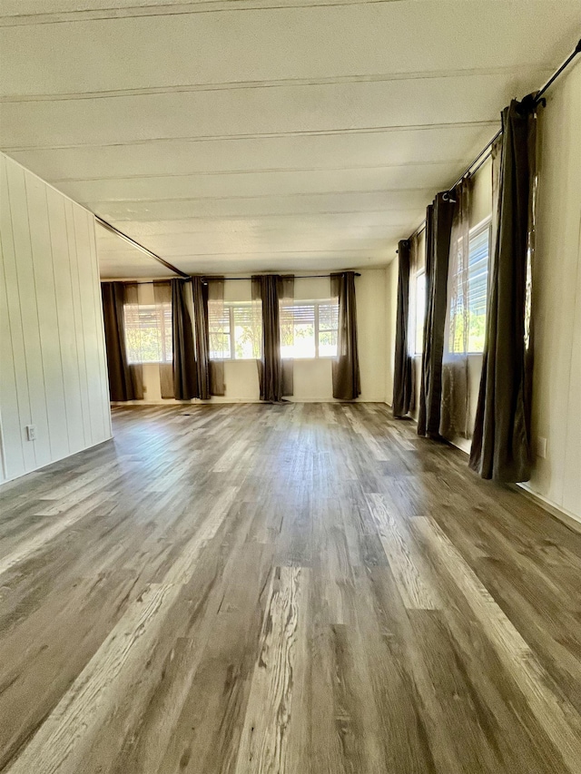 unfurnished living room with wood finished floors