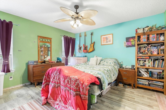 3372 9th St, Elkton, FL 32033 - bedroom with a ceiling fan and wood finished floors