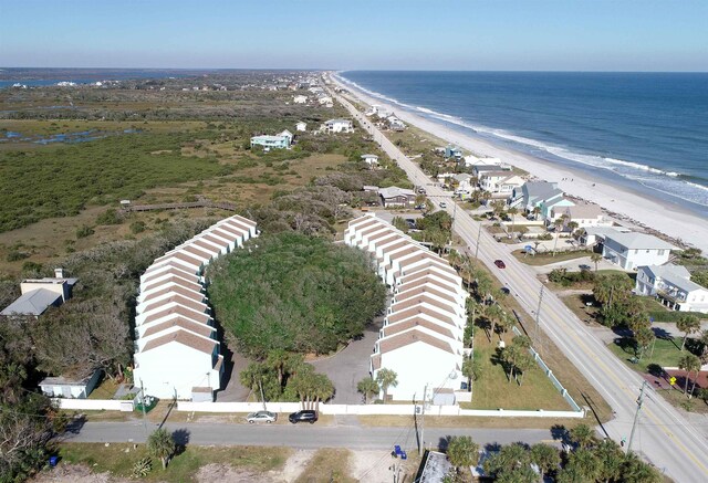 drone / aerial view featuring a view of the beach and a water view