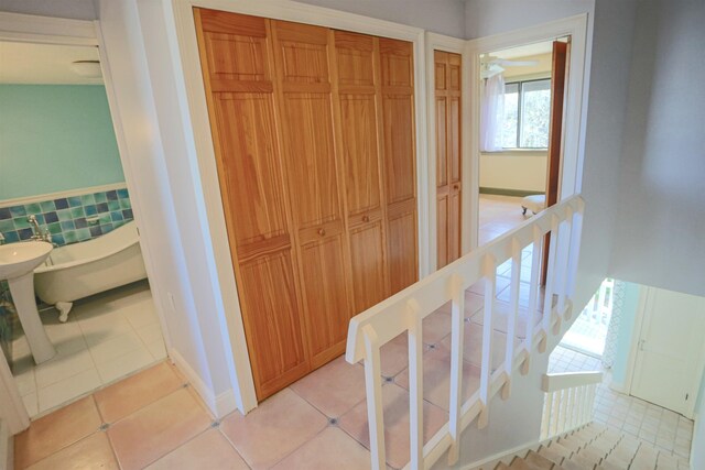 hallway with light tile patterned floors