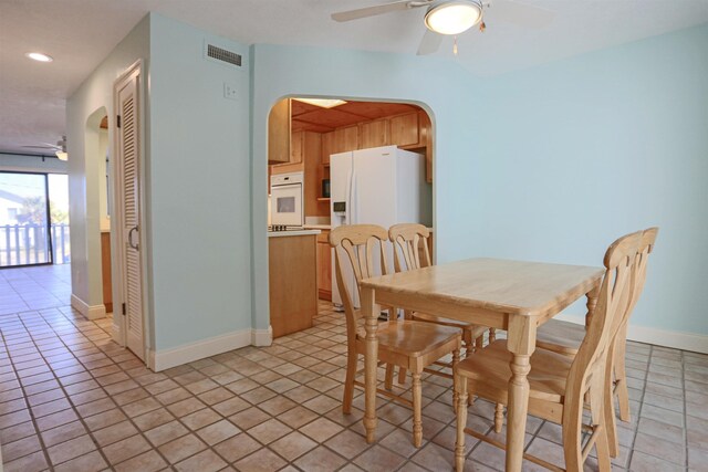 dining room featuring ceiling fan and light tile patterned floors