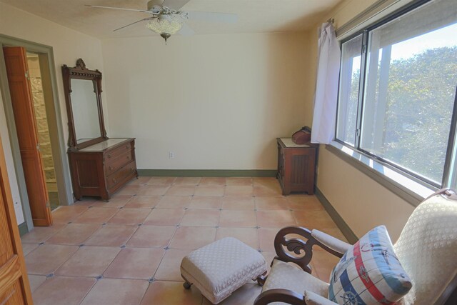 sunroom / solarium with ceiling fan