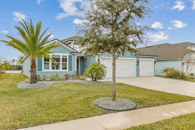 view of front of home featuring a garage and a front yard