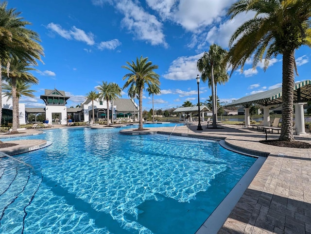 view of swimming pool featuring a gazebo and a patio