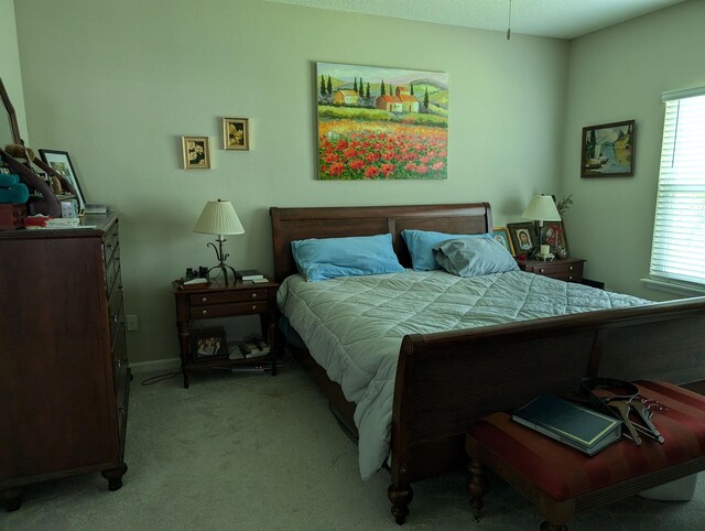 bedroom with light colored carpet