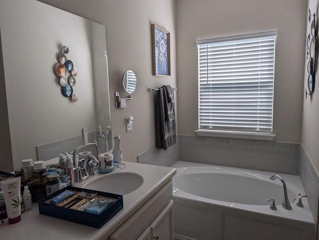 bathroom with vanity and a tub to relax in