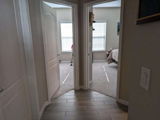 corridor featuring carpet flooring