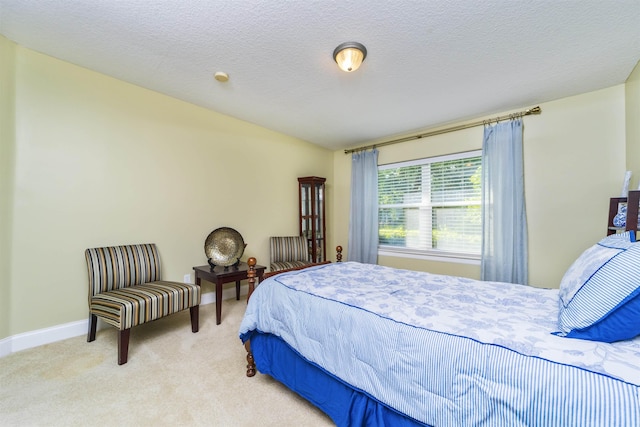 carpeted bedroom with a textured ceiling