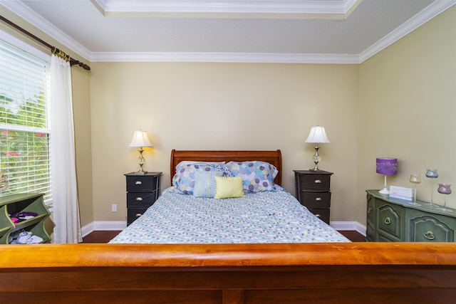 bedroom featuring crown molding and dark wood-type flooring