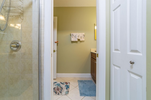 bathroom with tile patterned flooring, vanity, and an enclosed shower