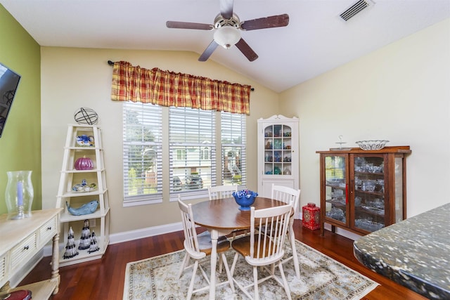 dining room featuring ceiling fan, dark hardwood / wood-style flooring, and lofted ceiling