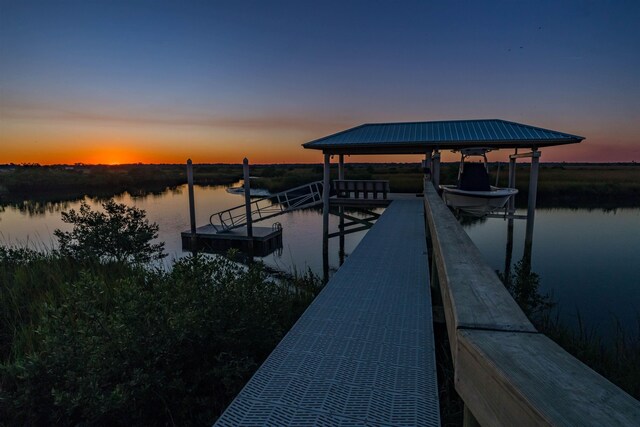 dock area with a water view