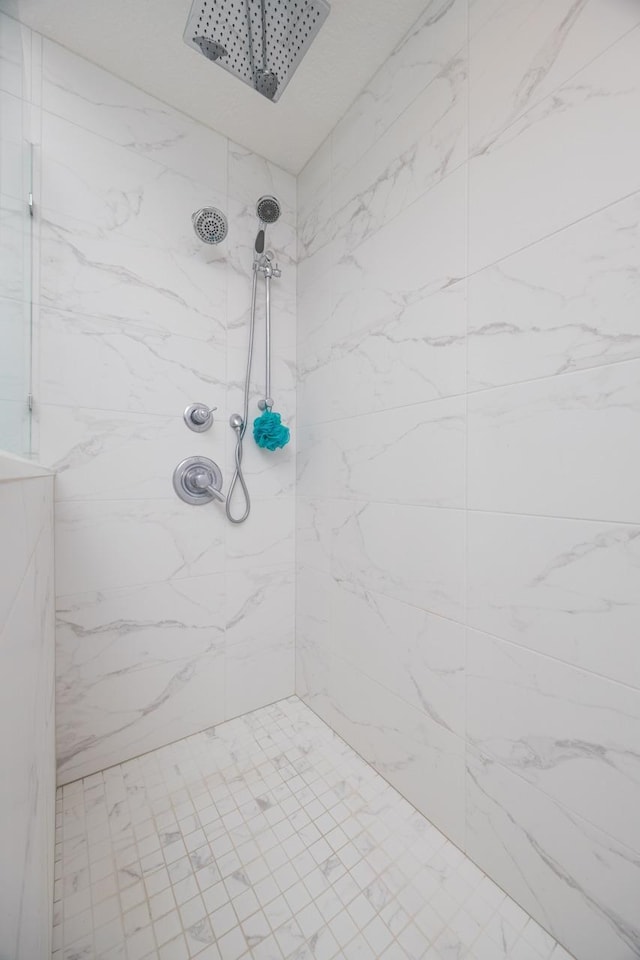 bathroom with tiled shower