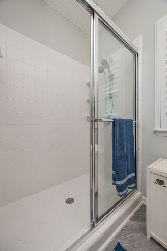 bathroom featuring an enclosed shower