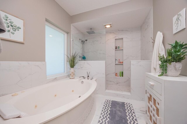 bathroom with a wealth of natural light and independent shower and bath