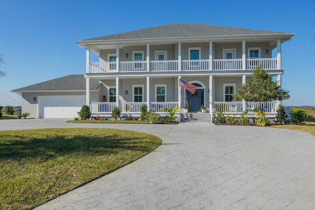 view of front facade with a garage and a front lawn