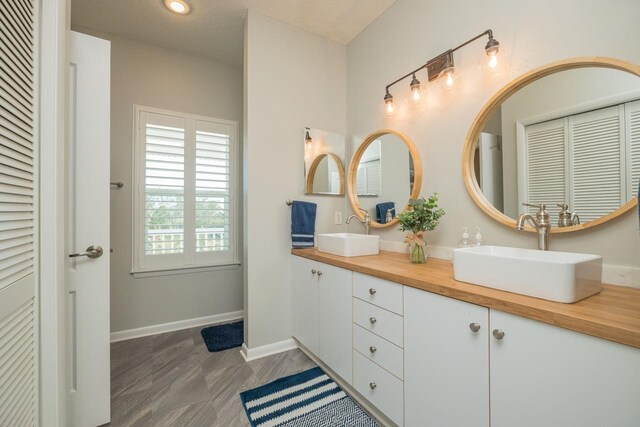 bathroom featuring vanity and a textured ceiling