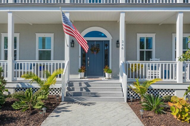 property entrance featuring covered porch