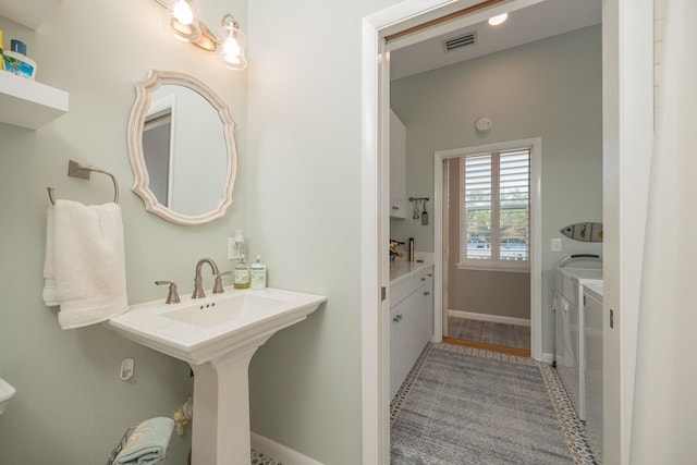 bathroom with separate washer and dryer