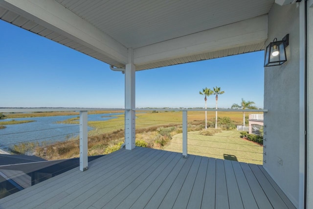 deck featuring a rural view and a water view