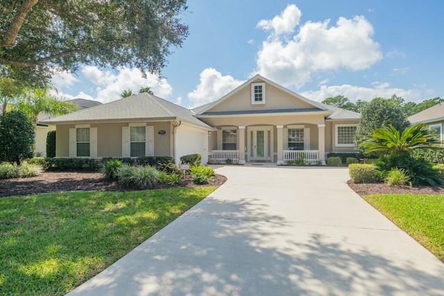 view of front of home with a porch and a front yard