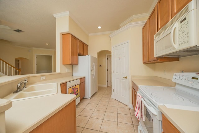 kitchen featuring sink, light tile patterned floors, white appliances, and ornamental molding