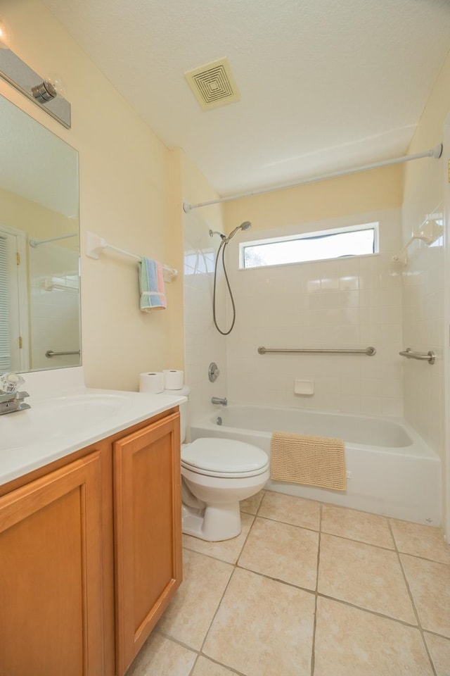 full bathroom with tile patterned flooring, vanity, toilet, and tiled shower / bath combo