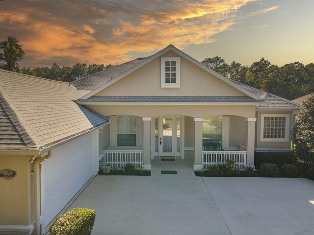 view of front of house featuring a garage and covered porch