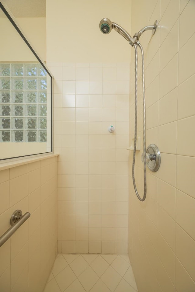 bathroom with tiled shower