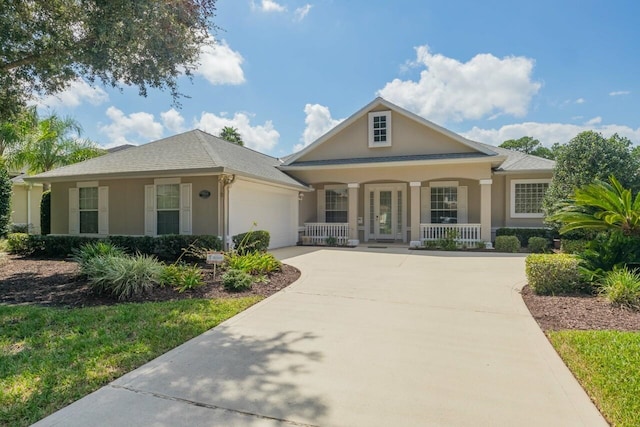 view of front of property with a garage and covered porch