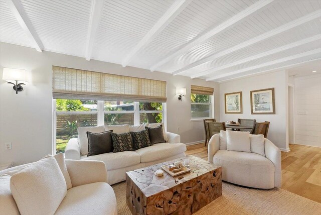 22 Madeira Dr, Saint Augustine, FL 32080 - living room featuring baseboards, light wood-style floors, and beamed ceiling