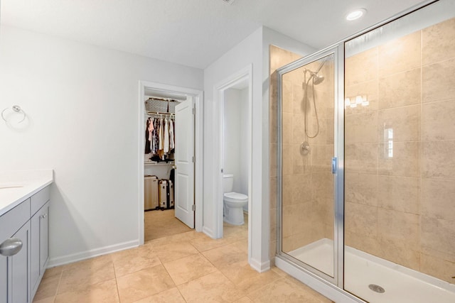 269 Clarys Run, Saint Augustine, FL 32092 - bathroom with a shower stall, vanity, tile patterned flooring, and a spacious closet