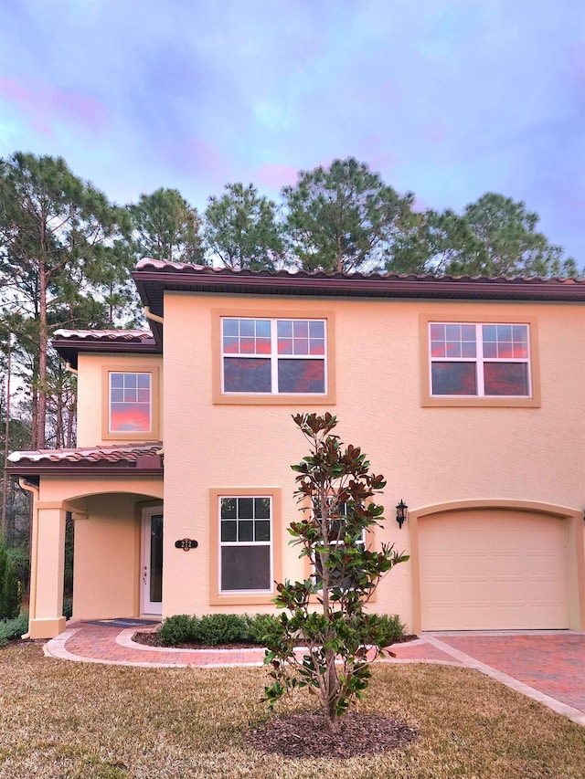 272 Grand Ravine Dr, Saint Augustine, FL 32086 - view of front facade featuring stucco siding and a garage