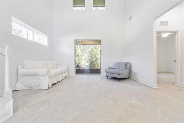 272 Grand Ravine Dr, Saint Augustine, FL 32086 - sitting room with a high ceiling, light marble finish floors, and a ceiling fan