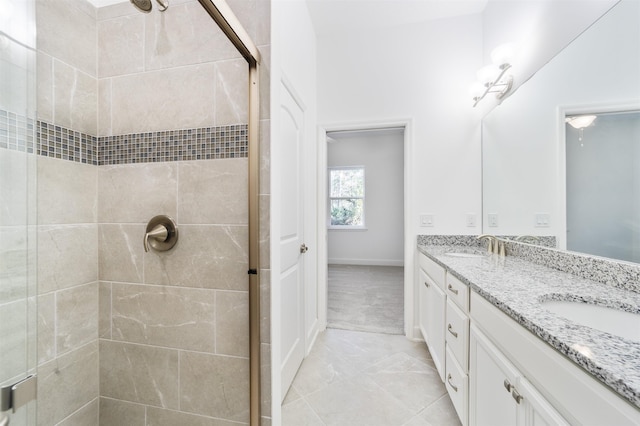 272 Grand Ravine Dr, Saint Augustine, FL 32086 - full bathroom featuring double vanity, a shower stall, and baseboards