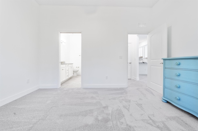 272 Grand Ravine Dr, Saint Augustine, FL 32086 - unfurnished bedroom featuring light colored carpet, baseboards, and connected bathroom