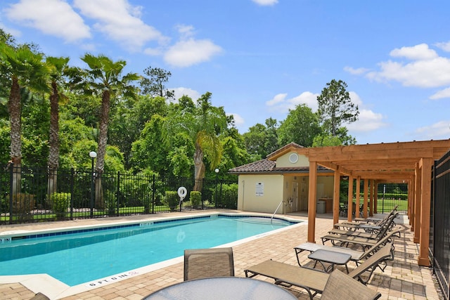 272 Grand Ravine Dr, Saint Augustine, FL 32086 - community pool with a patio area, a pergola, and view of scattered trees