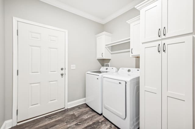 clothes washing area with dark hardwood / wood-style flooring, cabinets, separate washer and dryer, and crown molding