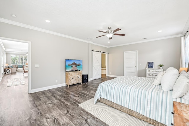 bedroom with a barn door, ceiling fan, and crown molding