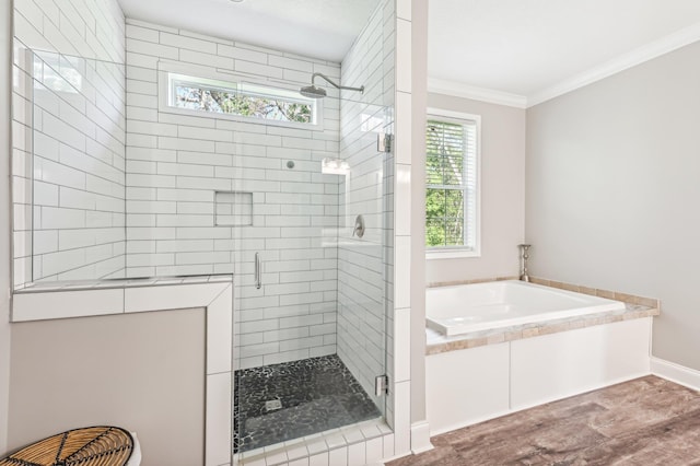 bathroom featuring plus walk in shower, wood-type flooring, and crown molding