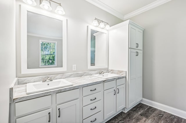 bathroom featuring hardwood / wood-style floors, vanity, and ornamental molding