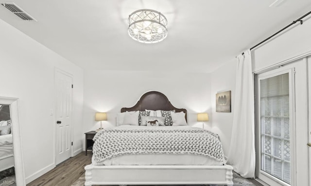 bedroom with wood-type flooring