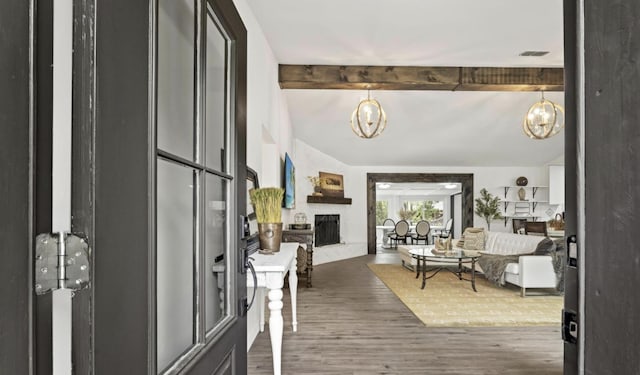 entryway featuring dark hardwood / wood-style floors and beamed ceiling